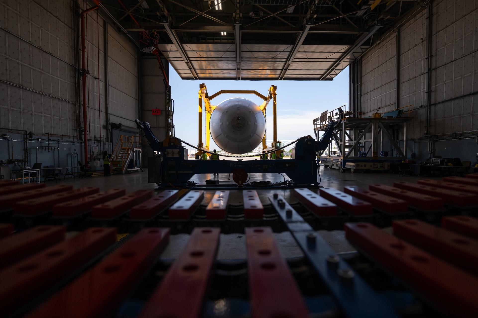 Teams at NASA’s Michoud Assembly Facility in New Orleans move a liquid oxygen tank from the main rocket factory into the adjacent vertical assembly building. The liquid oxygen tank, which will form part of the SLS (Space Launch System) rocket for NASA’s Artemis IV mission to the Moon, is rotated from a horizontal to a vertical configuration and loaded into the high bay’s hydrostatic proof testing cell. This non-destructive evaluation method tests the structural integrity of the tank’s welds by filling the tank with water, simulating the propellant used during launch. The propellant tank will hold more than 196,000 gallons of super-cooled liquid oxygen at launch and is one of five major elements that make up the 212-foot-tall SLS rocket stage. The core stage, along with its four RS-25 engines at its base, produces more than two million pounds of thrust to help launch NASA’s Orion spacecraft, astronauts, and supplies beyond Earth’s orbit and to the lunar surface for Artemis.